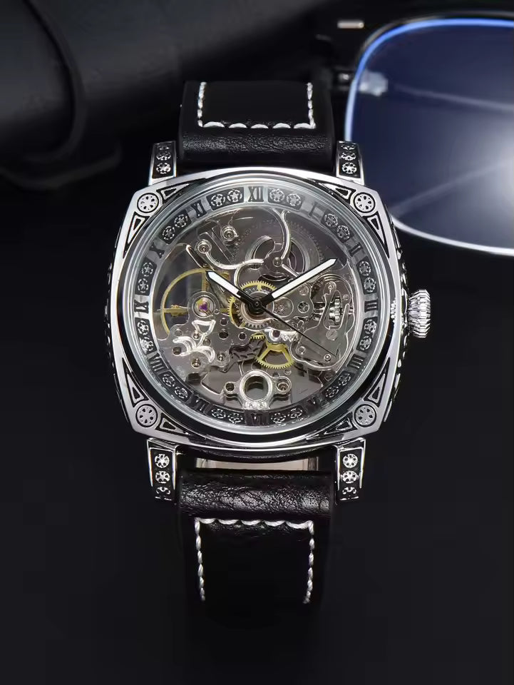 Silvery Black — silver-tone automatic skeleton watch with black leather strap