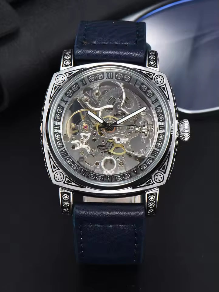 Silver Blue — silver-tone automatic skeleton watch with navy leather strap