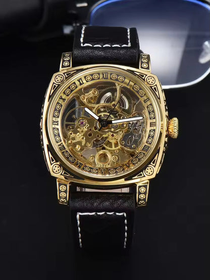 Gold Black — gold-tone automatic skeleton watch with black leather strap
