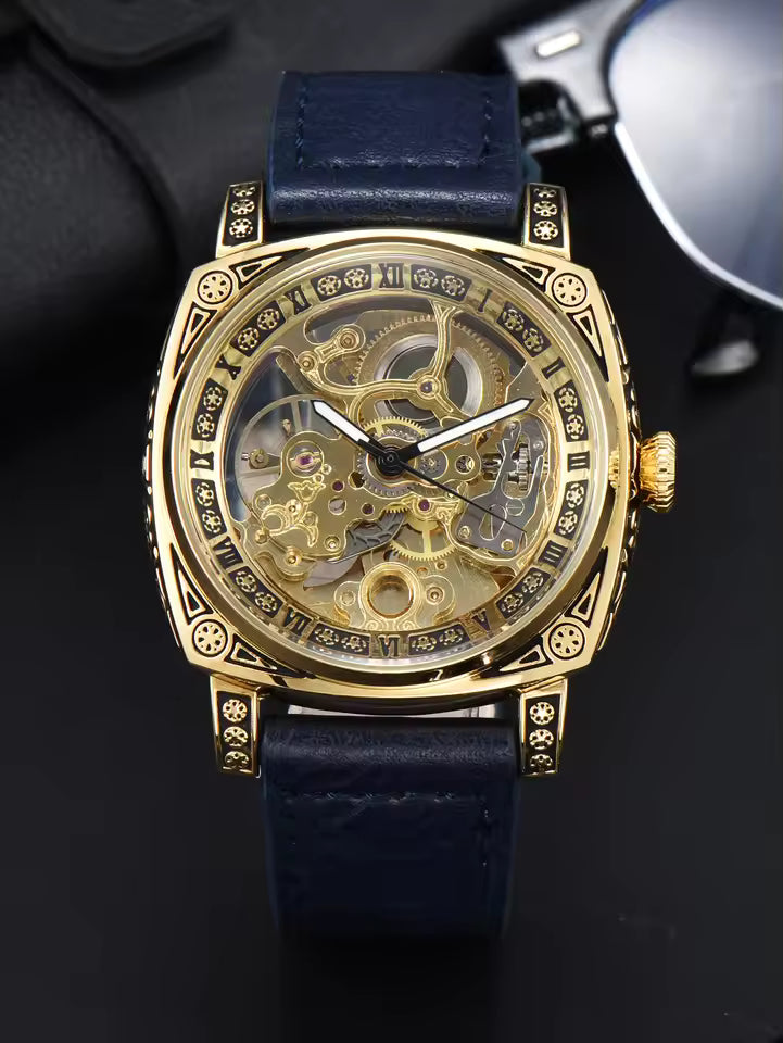 Gold Blue — gold-tone automatic skeleton watch with navy leather strap